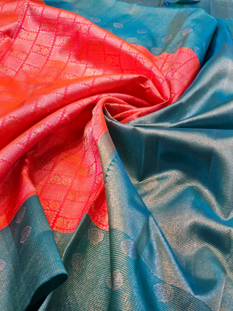 Kanchipuram silks - Coral Pink with Peacock Blue & Silver Zari